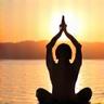 Person stretching at sunrise